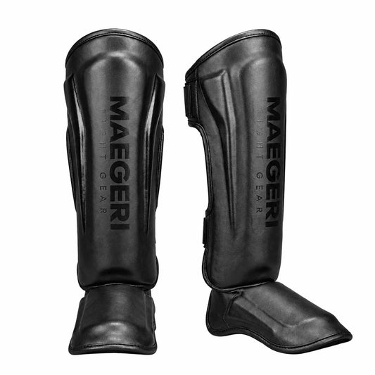 Maegeri MMA shin guards in black - front view